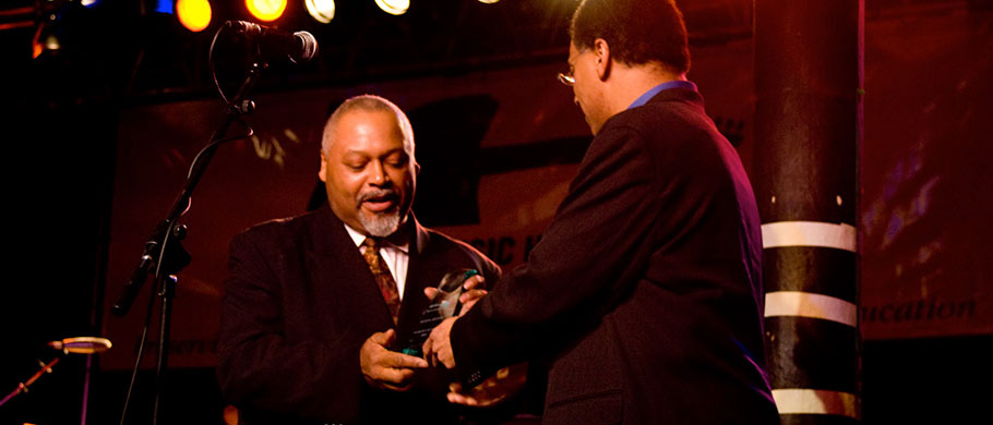 Carlton Jackson receives award from Marty Hughley